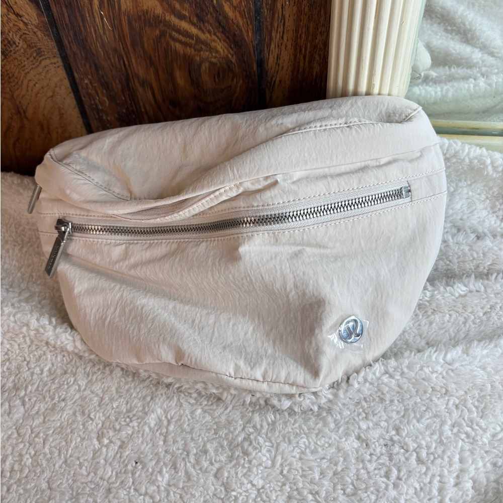 Lululemon Athletica Cream Crossbody Bag with Crescent Shape